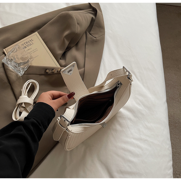 The 2025 new underarm bag for women is a simple and versatile single-shoulder crossbody bag. It is a popular and niche designer crescent-shaped women's bag undefined