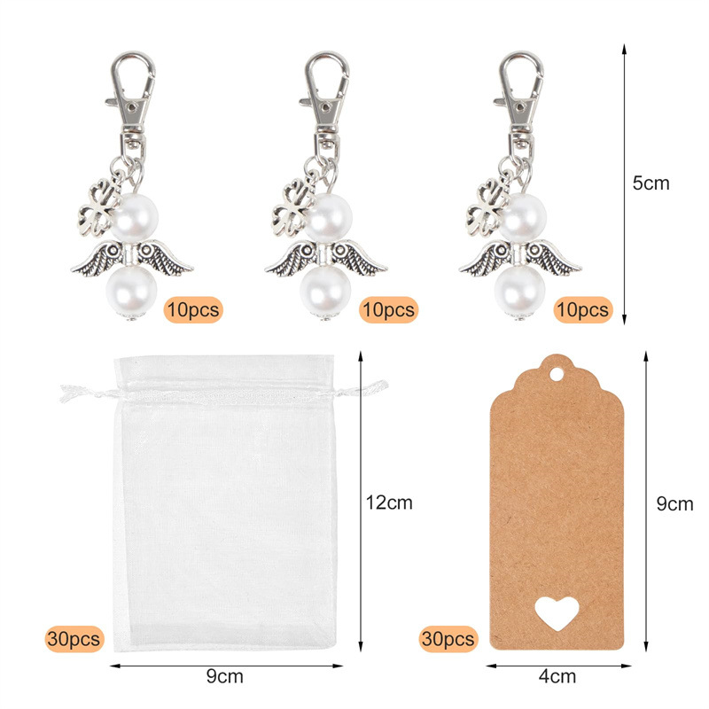 Venta caliente transfronteriza Llavero Trébol de cuatro hojas Estilo de moda etiqueta de regalo de mano Juego de caja de regalo de fiesta de boda