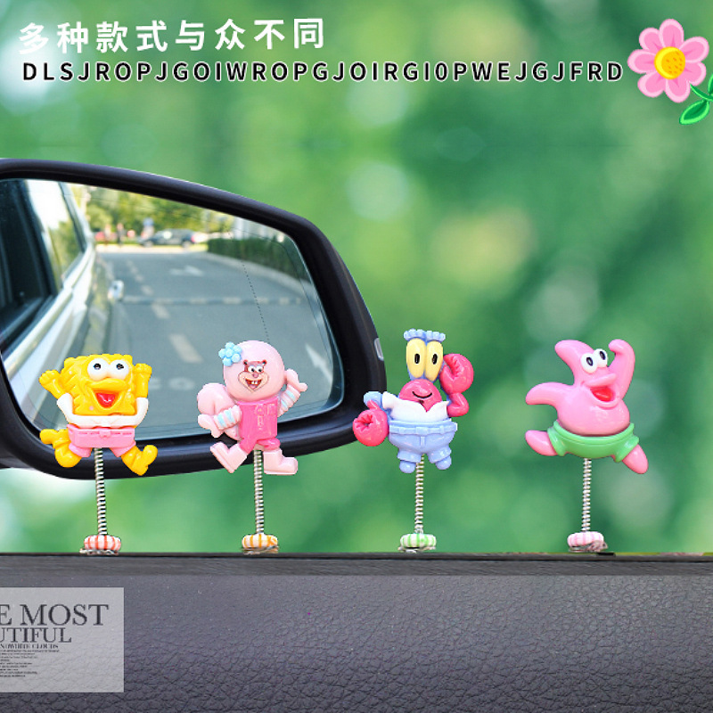 Nuevos productos adorables adornos de automóviles muñecas creativas decoraciones interiores de automóviles primavera sacudiendo la cabeza cabeza cabeza cabeza sala de transmisión directa con mercancías