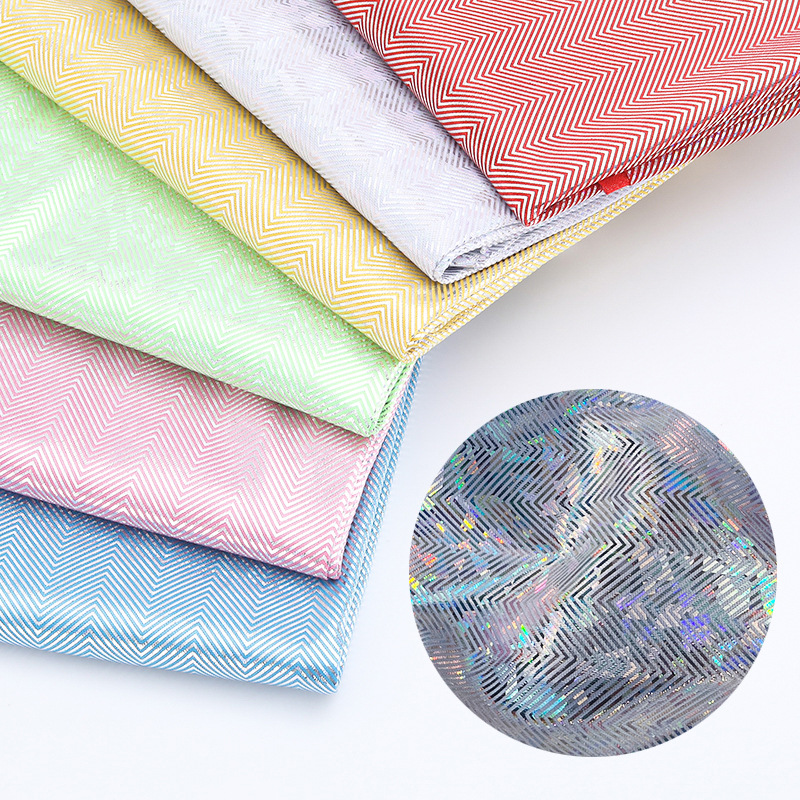 七彩镭射布料幻彩镭射玻璃花烫金人字纹面料舞台演出服装娃娃裙布