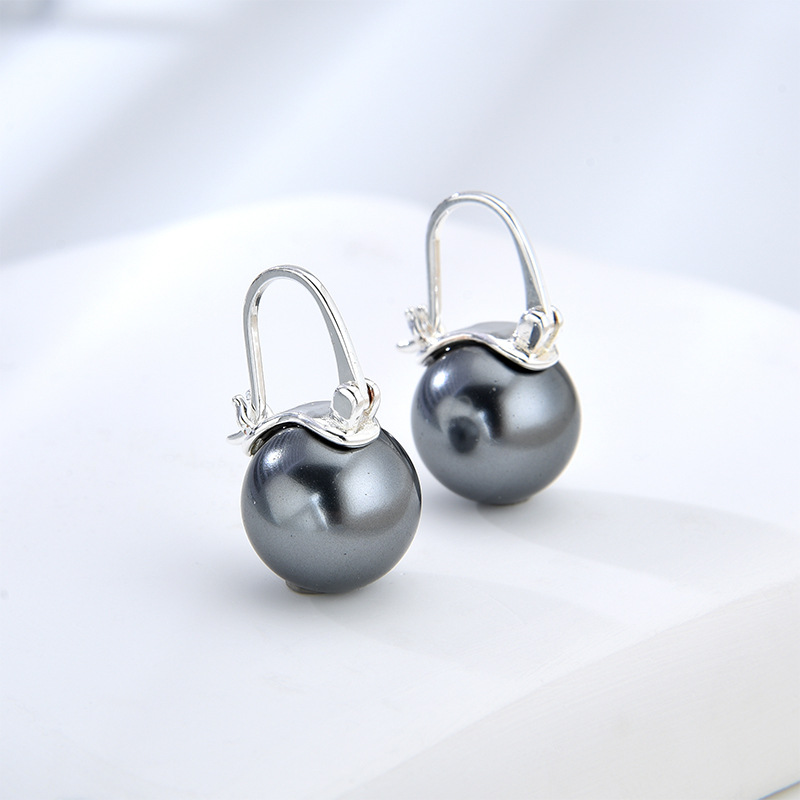 Coreano Shijia Pearl 925 botón de orejas de plata estilo francés de estilo de viaje nicho personalidad simple temperamento de alta calidad pendientes