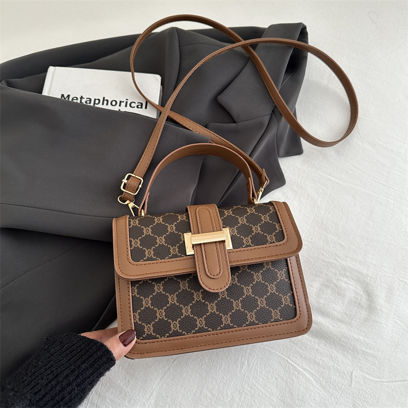 2025 nueva moda simple de alto valor de cara bolso de hombro de moda retrógrada impresión de personalidad bolso de viaje portátil pequeño