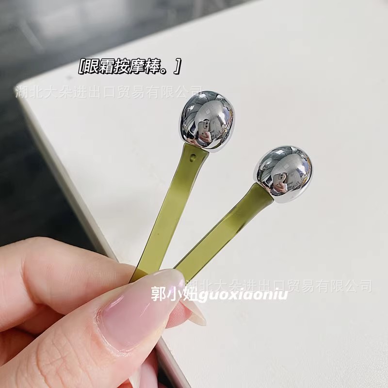 郭小娘の目のマッサージ棒の手動の目のクリームのマッサージ器の美化粧のツールの精華は棒のボールを導入して塗ります。