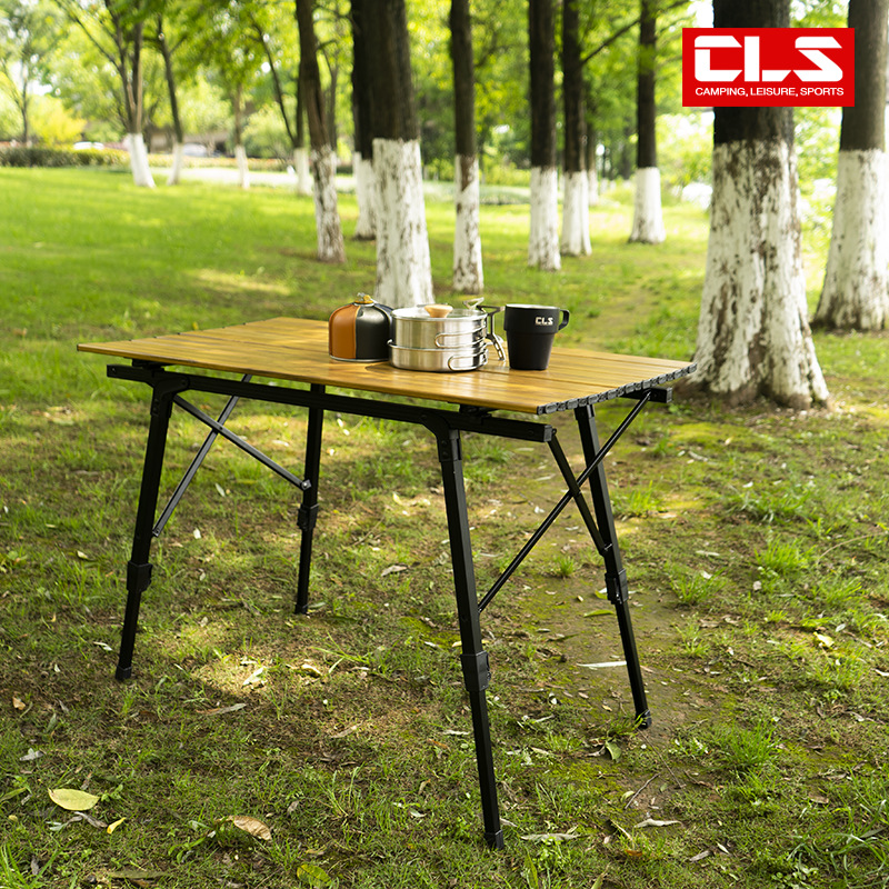Mesa plegable al aire libre grano de madera aleación de aluminio mesa de rollo de huevo gran elevación camping mesa de comedor portátil camping auto-conducción mesa de aluminio