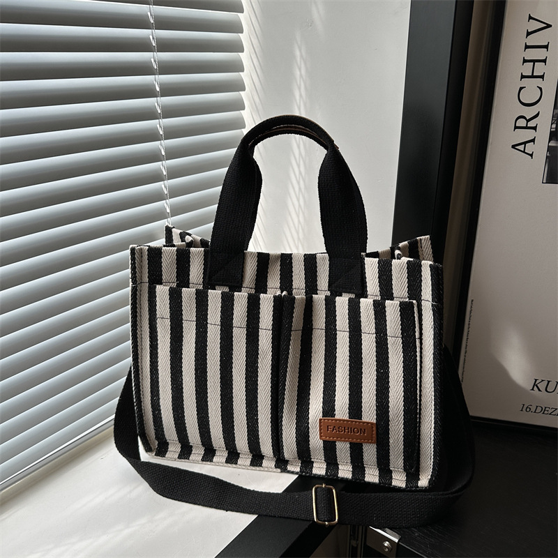 Bolsas de gran capacidad de transporte 2024 nuevas bolsas de mujer populares bolsas de lona a rayas bolsas de mochilas de moda bolsas de mano