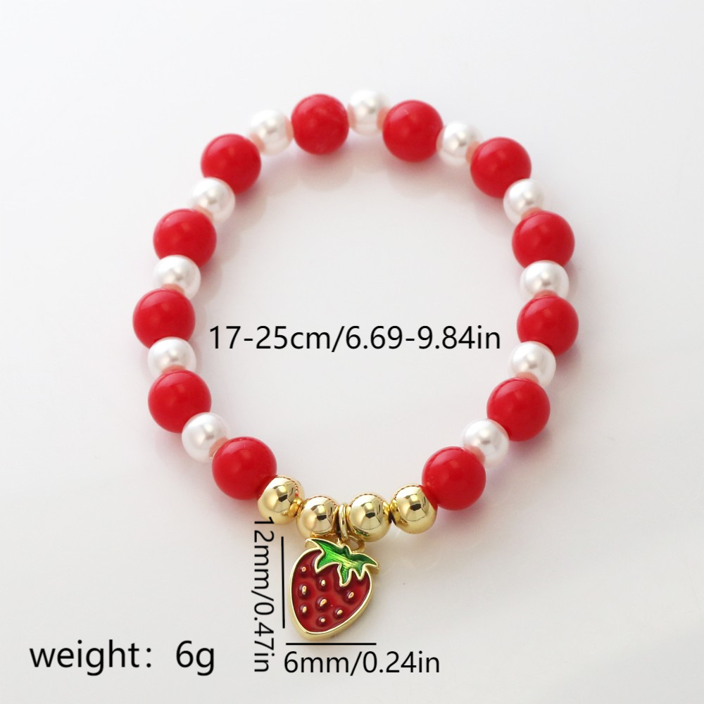 Pulsera con labios, perla y fresa esmaltados