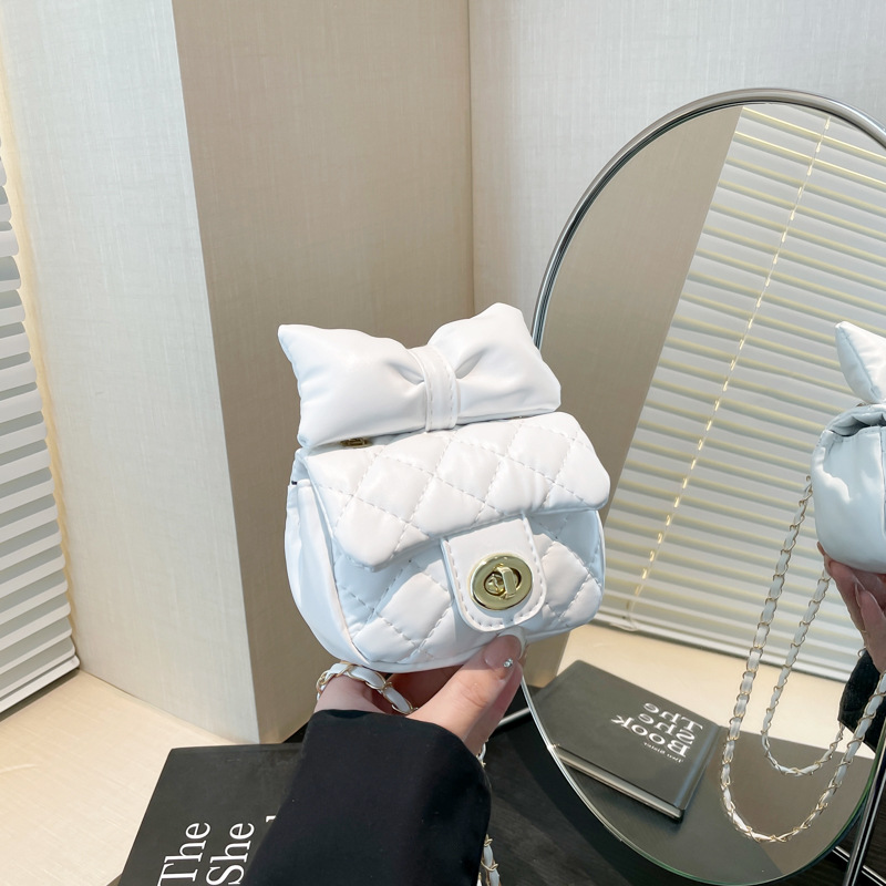 Bolsa de textura 2025 nueva moda extranjera cadena mochila primavera y verano nicho dulce arco mini bolso