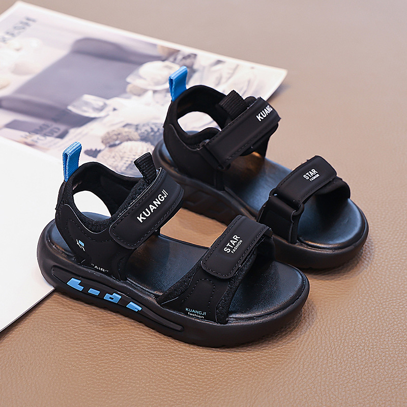 Niños huecos zapatos de playa de dedo abierto 2026 verano nuevo estilo de moda infantil sandalias versátiles sandalias de niños mayores