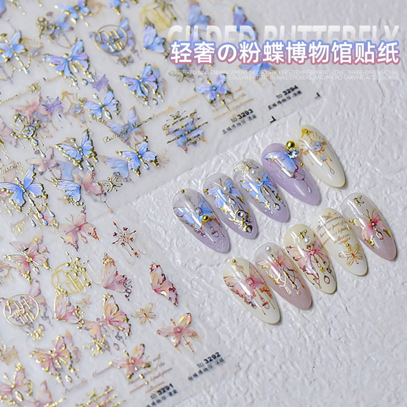 Pegatinas de uñas doradas populares pegatinas de uñas lindas japonesas alivio de fábrica mariposa tridimensional Shell luz Rosa mariposa al por mayor