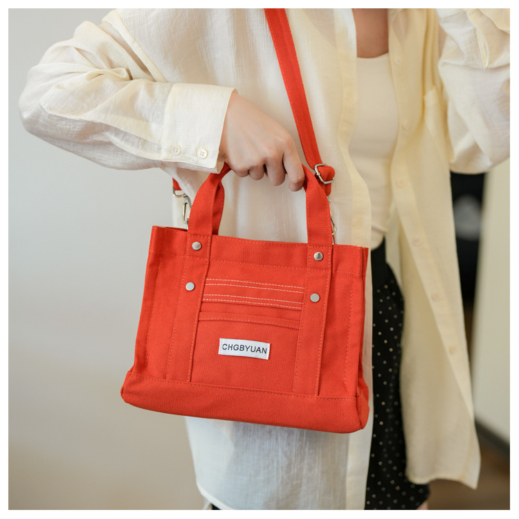 Transfronterizos directos de venta caliente de Amazon tela bolsa de mano para mujeres 2024 nuevo estilo de alta sensación de hombro mochila