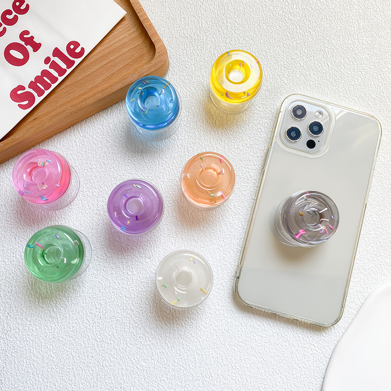 Transparent mobile phone airbag bracket, solid color donut adhesive, stable desktop, lazy person watching chasing_voghion.com