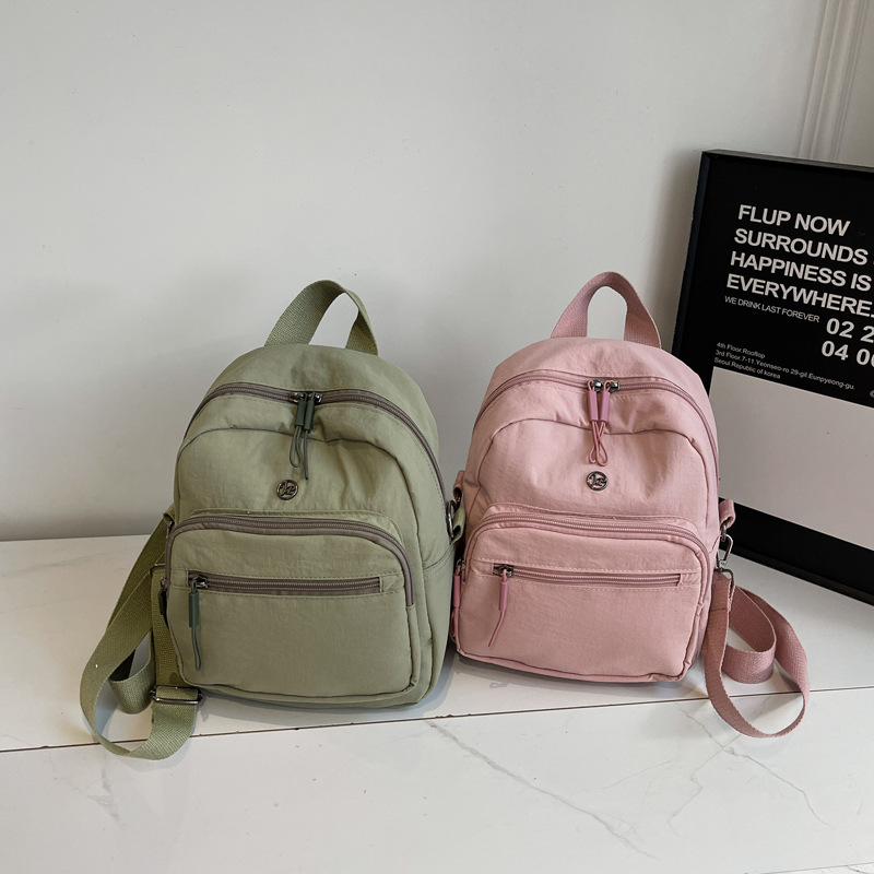 Mini mochila ligera coreana de moda casual mochila de viaje al aire libre de viaje de viaje simple mochila de estudiantes