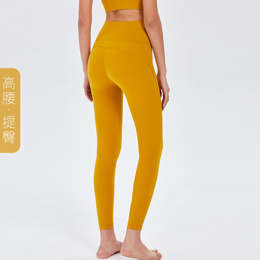 Pantalones de Yoga de cintura alta desnuda europea y americana de las mujeres Peach Hip lifting Pantalones deportivos ajustados pantalones de fitness de secado rápido