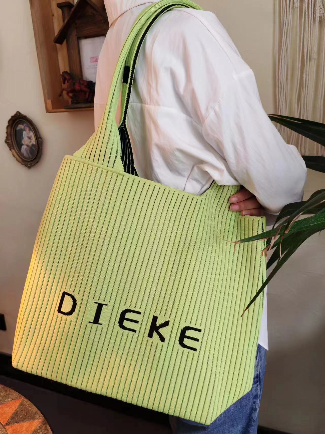 The new large-capacity fly-woven bag with louvers and letters is a portable and fashionable handbag that can be worn on one shoulder undefined