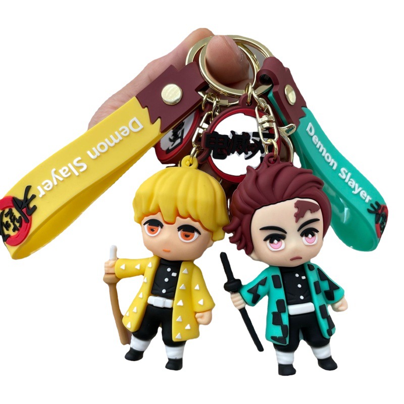 鬼滅の刃の鍵は自動車のキーチェーンの漫画の公仔のかばんのペンダントの子供機の小さい贈り物の卸売りを掛けます。