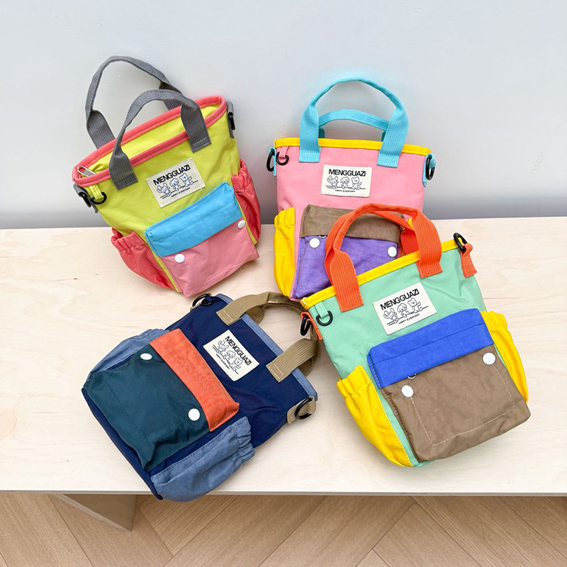 2026 nuevo bolso infantil coreano dopamina diseño de contraste de color bolso bebé bolso de mano deportivo al aire libre bolso de mochila ligero