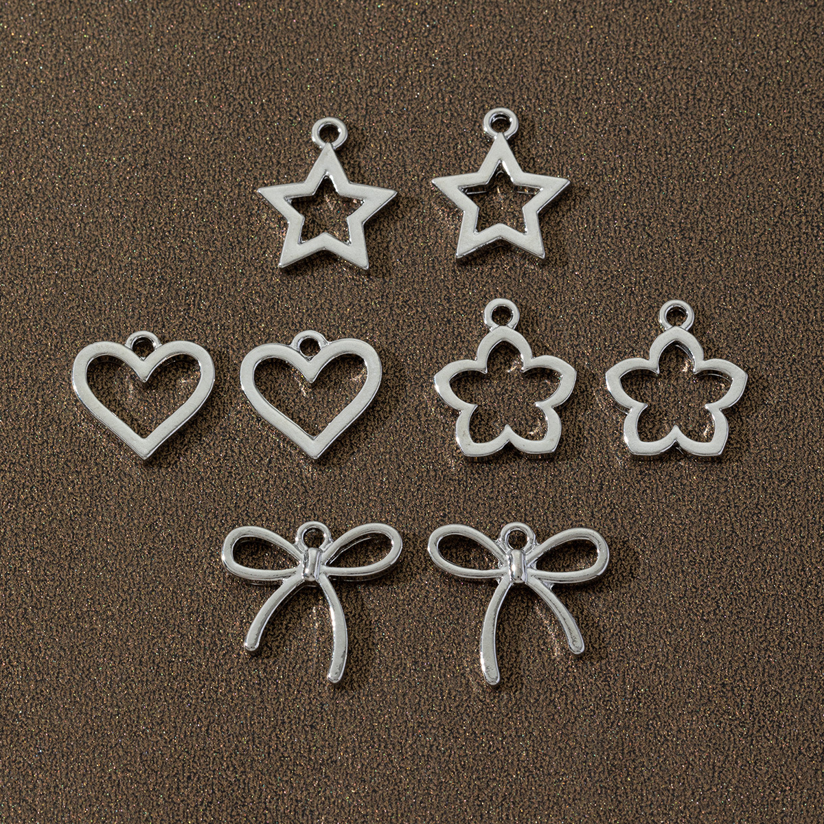 Protección del medio ambiente hueco amor estrella lazo colgante bricolaje collar de materiales hechos a mano bricolaje accesorios de joyería de aleación al por mayor