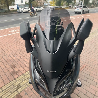 Motorcycle front windshield thickened and elevated windshield