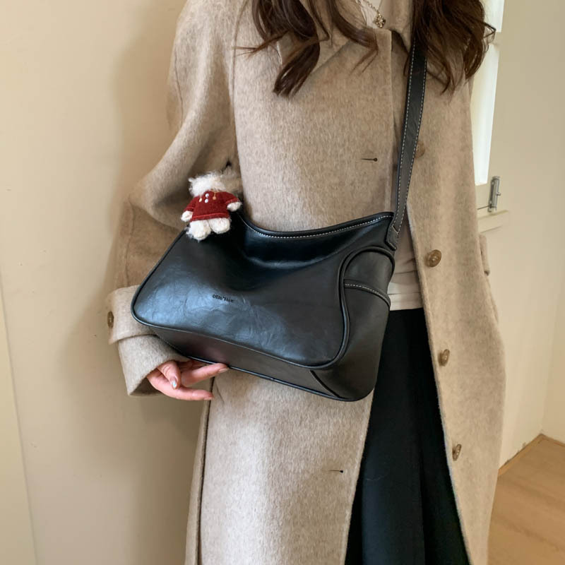 Coreano de cuero suave de alto nivel de hombro bolso de brazo para mujeres 2025 nueva bolsa de transporte de viaje bolsa casual versátil mochila