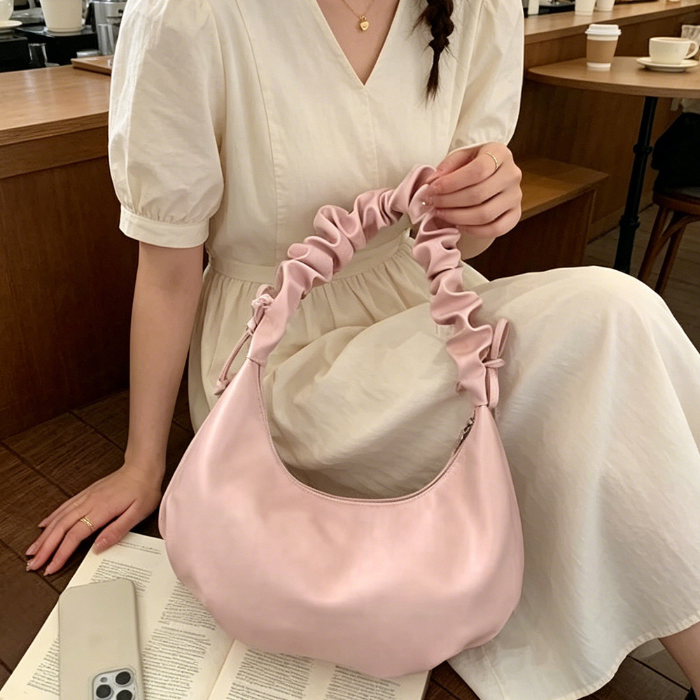 2026 nuevo estilo de mujer bolso de estilo extranjero bolso de moda alta sensación de nube bolso de hombro viento dulce simple plegado