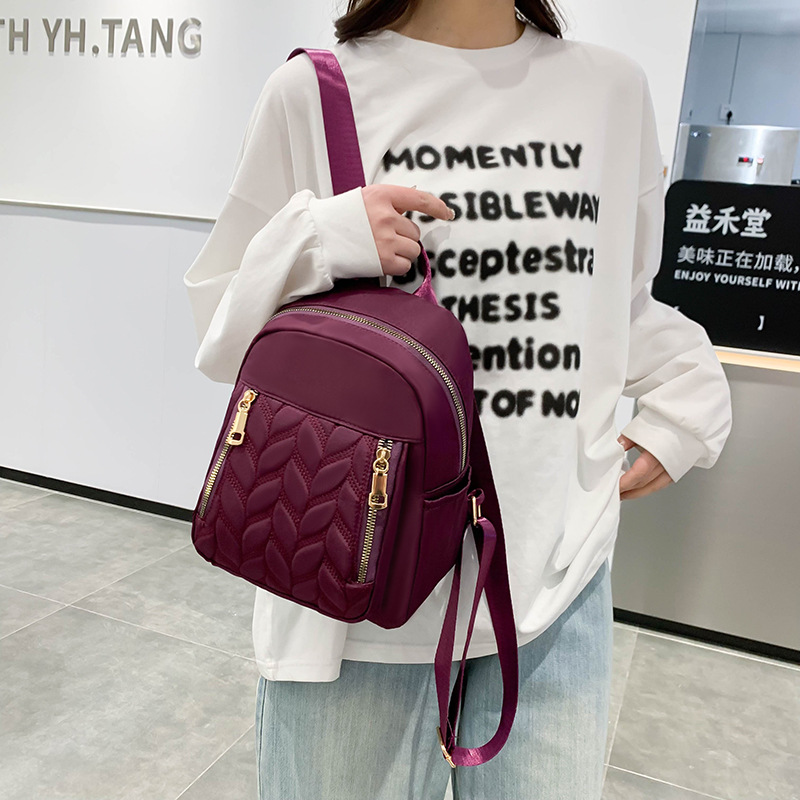 Mochila de moda transfronteriza para mujer, nueva mochila casual de rombo simple, bolsa de tela de color sólido de tendencia coreana al por mayor