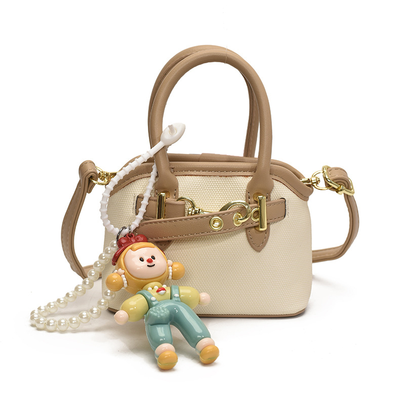 Bolsos de mano para niños lindos colgantes extranjeros mini bolsos de hombro para niños y niñas de color sólido simple bolsos de conchas de niños de moda
