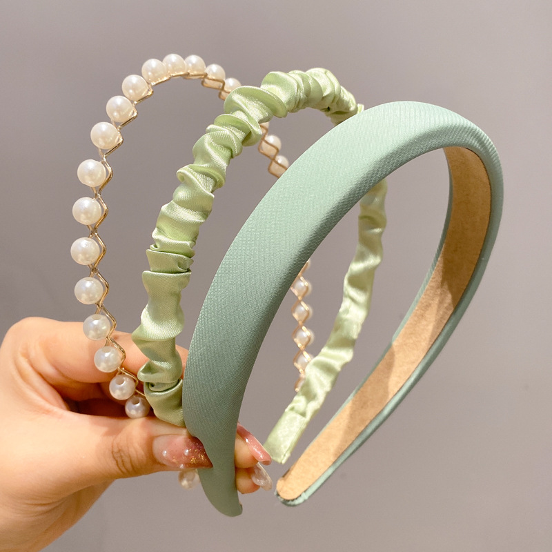 A principios de la primavera, la banda de cabello para mujeres en línea, 2025 nuevo lavado de cara de presión de tarjeta de cabello para el cabello, banda de cabello de perlas, banda de cabello para mujeres.