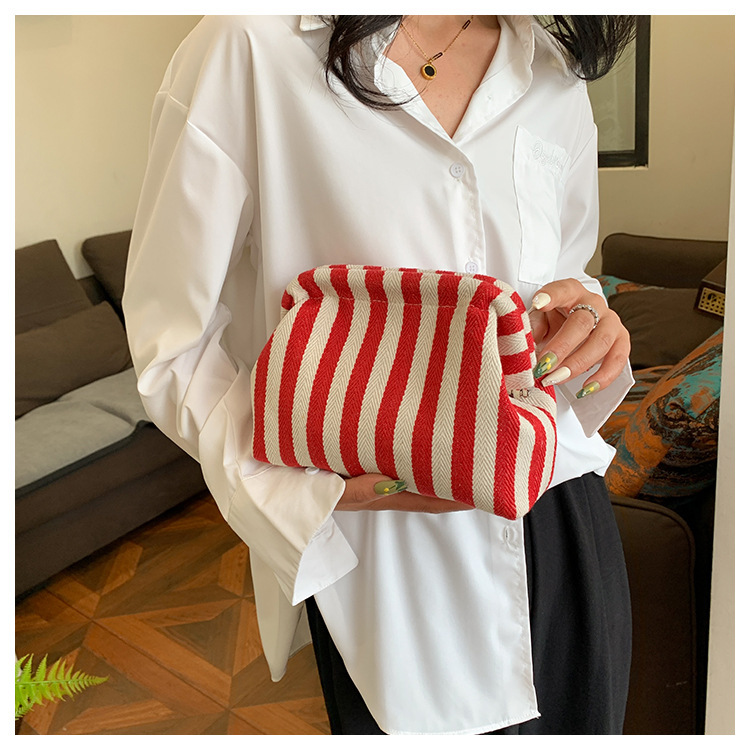 New cross-border fashion color-blocking striped cosmetic bag, women's loose change mobile phone storage bag, trendy and niche cloud clutch undefined