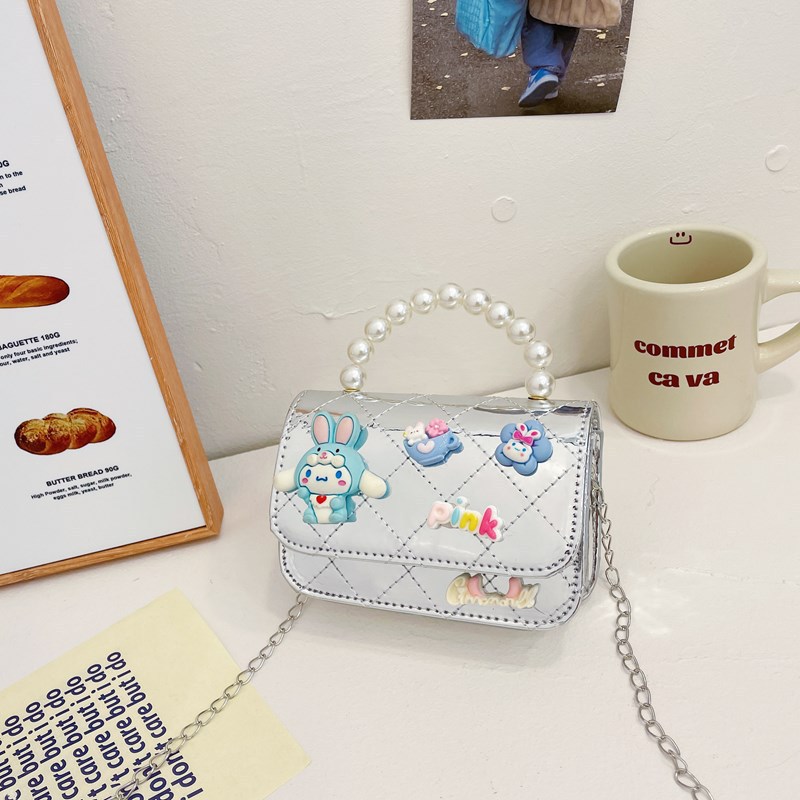 Bolso infantil 2024 nuevo estilo coreano de cadena de dibujos animados bolso de hombro estilo Xiaoxiang Ling mochila para hombres y mujeres bolsos pequeños