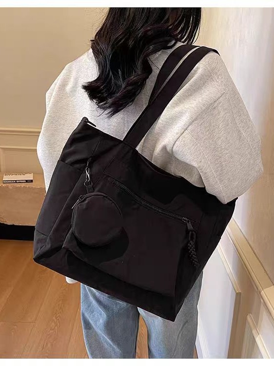 Transfronterizos casuales de color sólido nylon bolso de mano nueva bolsa de tela de transporte de gran capacidad simple y ligera mochila de hombro