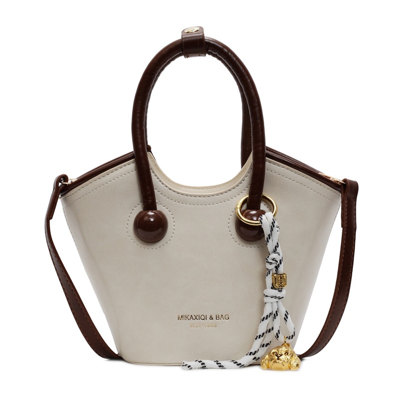 Bolsas de mano retro de color contrastante para mujeres 2025 nueva moda bolsas de hombro de estilo extranjero de alto nivel nicho bolsas de cubo