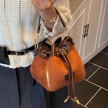 韩版小众手提水桶包女包2025新款简约日常感复古通勤包洋气斜挎包