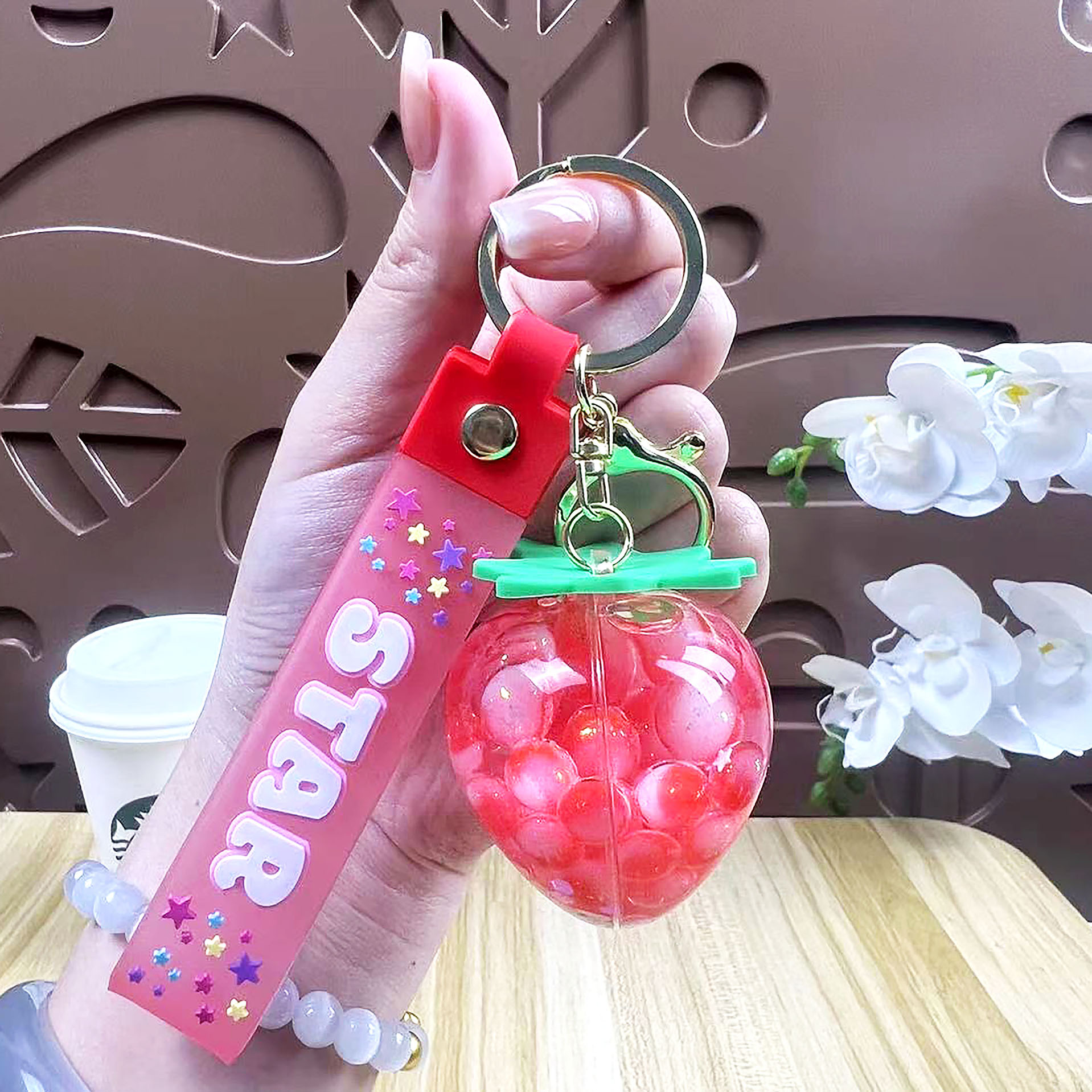 Perla leche taza de té oso colgante aceite flotante botella llavero femenino exquisito colgante mochila arenas movedizas colgante