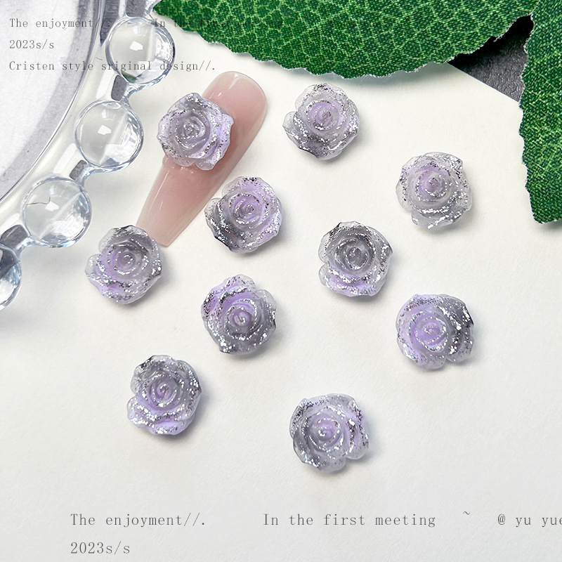 Nueva joyería de uñas de estilo gris-púrpura salvaje de estilo ins mezclada luminosa tridimensional de flores pequeñas accesorios de armadura al por mayor
