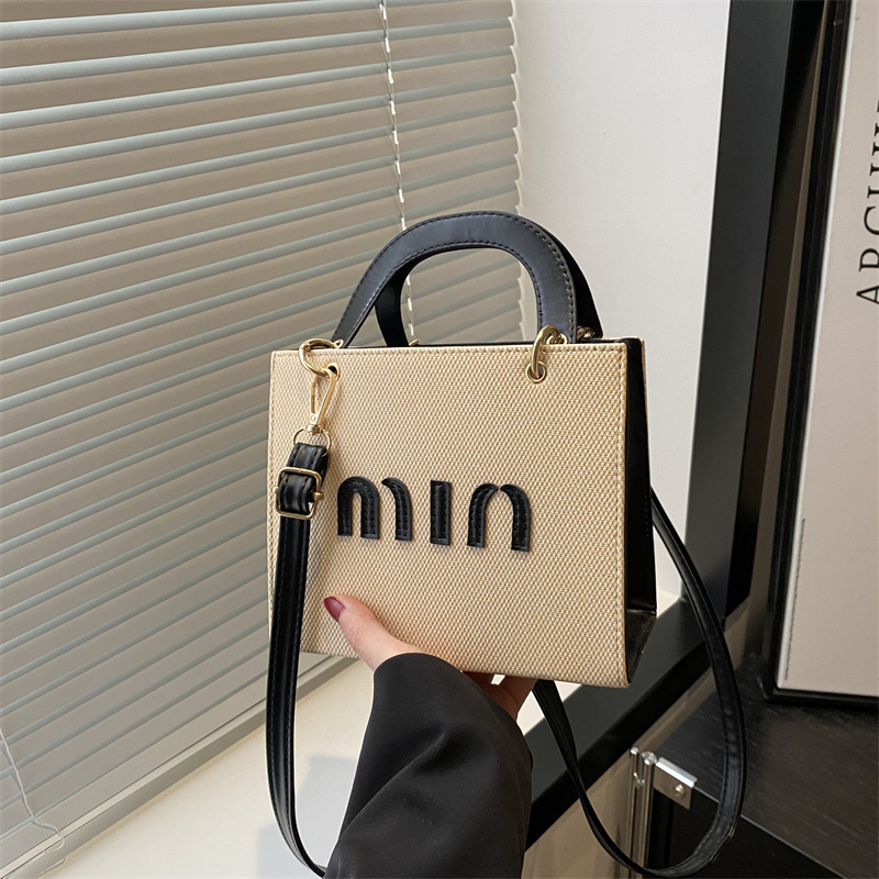 Bolso de mano de moda al por mayor color contraste bolso de mujer 2025 verano nueva letra de lujo bolso de hombro de viaje mochila