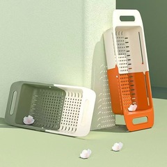 色を突いて伸縮している水たまりの二重の野菜のたまりの台所の水槽を洗って果物の野菜のかごを洗って穴を開けないで水たまりの棚を洗います。