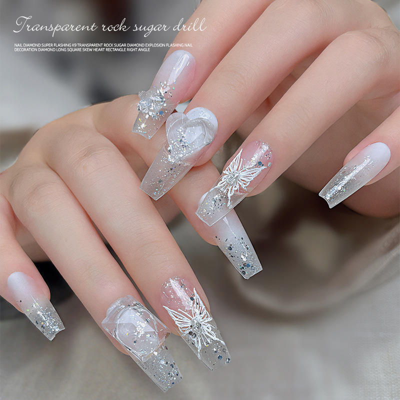Nail transparente puntiagudo diamante joyería 2023 popular Super Flash azúcar de roca paloma huevo Crooked Heart Glass nail accesorios al por mayor