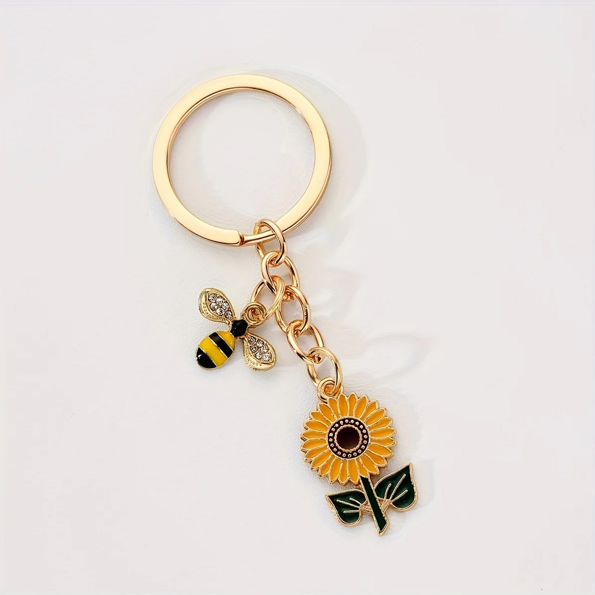 Ventas transfronterizas personales colgantes perlas abejas colgantes girasoles joyas de Navidad ardilla llaveros