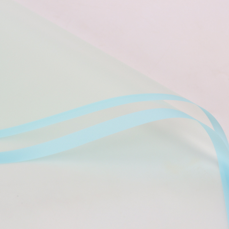 Día de San Valentín chino Ramo impermeable Material de papel de embalaje de flores Paquete de plástico BOPP Película de flores Papel mate de borde de color