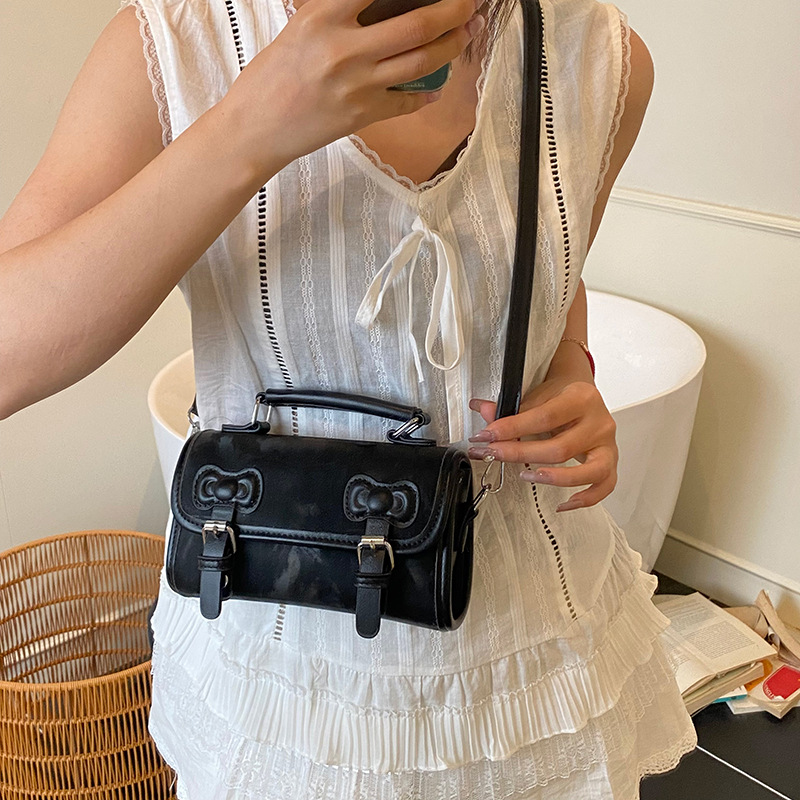 Summer Super Fire Hand lleva un pequeño bolso cuadrado femenino 2025 nuevo bolso de hombro con lazo de moda bolso de mensajero de estilo universitario de todo fósforo