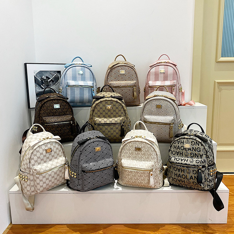 Mochila de fábrica para mujer 2023 nueva moda de verano estilo coreano moda de mujer mochila de gran capacidad bolsa pequeña de viaje para mujer