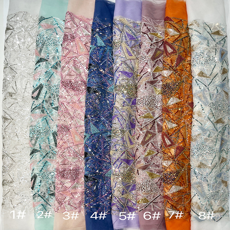 Proveedores de stock multicolor bordado de pailleta tela de tela de vestido de mujer bordado de pailleta tela