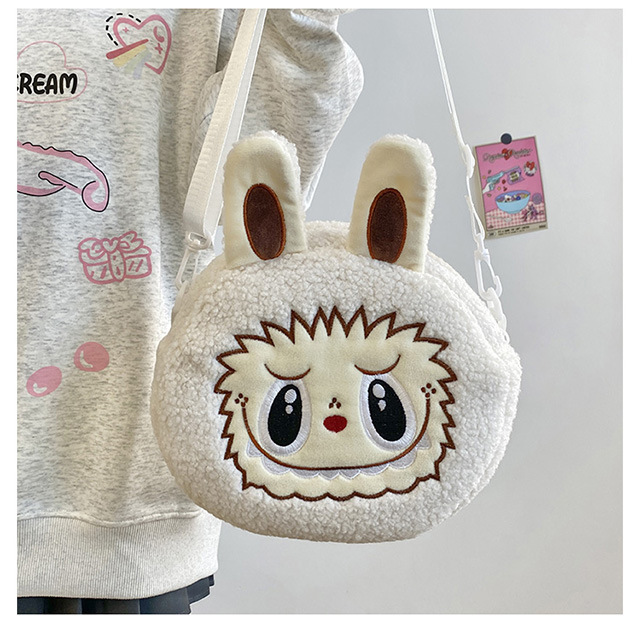 Venta directa de fábrica: bolsas de maquillaje de dibujos animados, muñecos de peluche, juguetes portátiles para niños, bolsos para mujer, muñecos de máquina de garras y otros productos.