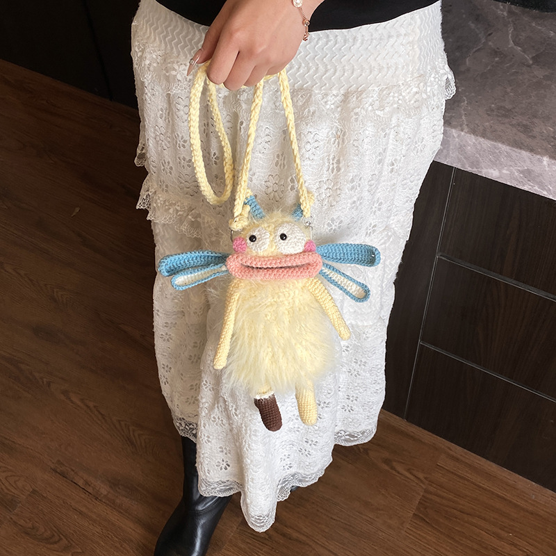 Hand-held ganchillo muñeca fea bolsa de hombro extraña bolsa de mochila de bebé invierno de peluche bolsa de salchicha boca de niños