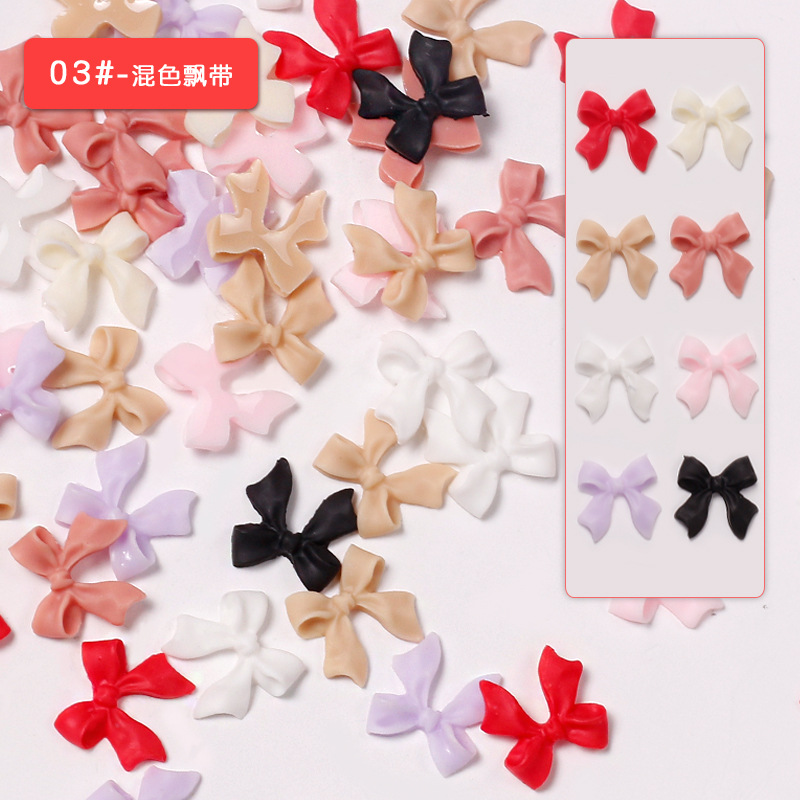 Joyas de arco de uñas al por mayor en línea explosión simple de resina joyas de uñas estereoscópicas flotantes mezcladas 50