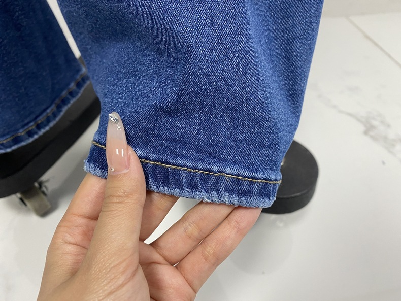 Jean évasé stretch vintage pour femme - Jean en denim délavé et usé, coupe pattes d'éléphant, idéal pour un look streetwear et rétro_voghion.com