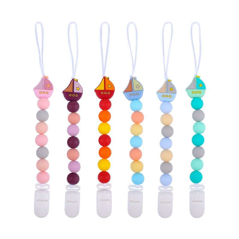 El Comercio exterior nuevo bebé suministros Cadena de chupete de silicona vela dientes de juguete de silicona de dibujos animados Cadena de molienda