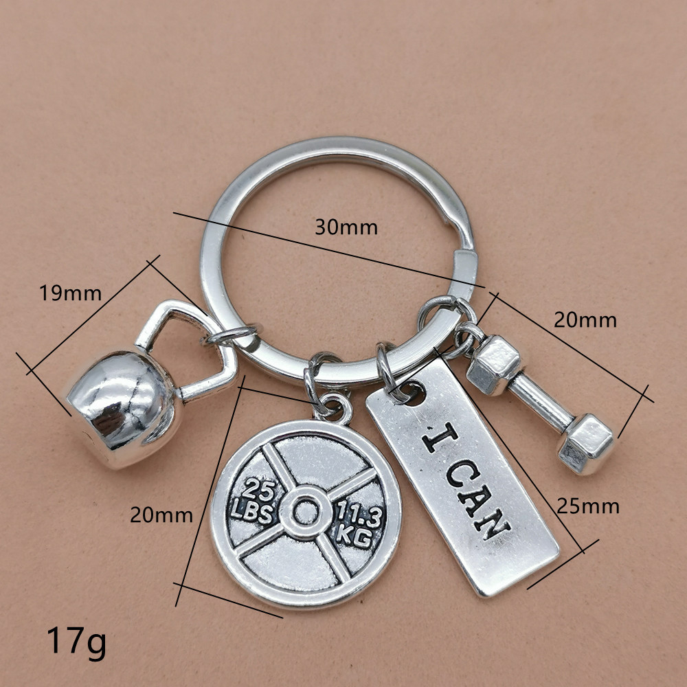 Nueva joyería europea y americana deportes poder mancuerna barra hervidor campana llavero hombres y mujeres pareja amistad llavero