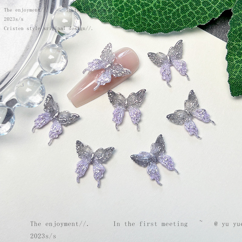 Nueva joyería de uñas de estilo gris-púrpura salvaje de estilo ins mezclada luminosa tridimensional de flores pequeñas accesorios de armadura al por mayor