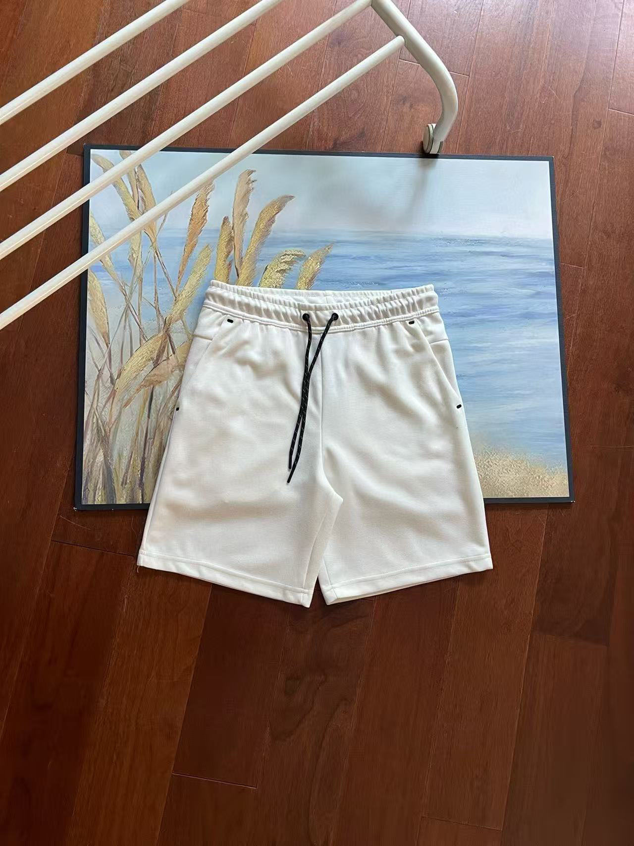 Verano nuevo estilo pequeño gancho versión en el extranjero de doce colores pantalones cortos deportivos de punto de pegamento lateral para hombres pantalones de cinco puntos 4503